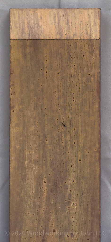 Buttermilk milk paint layered over Barn Red over Black Iron