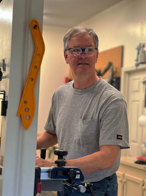 John White woodworker and mechanical engineer at the bandsaw in his Lexington SC workshop